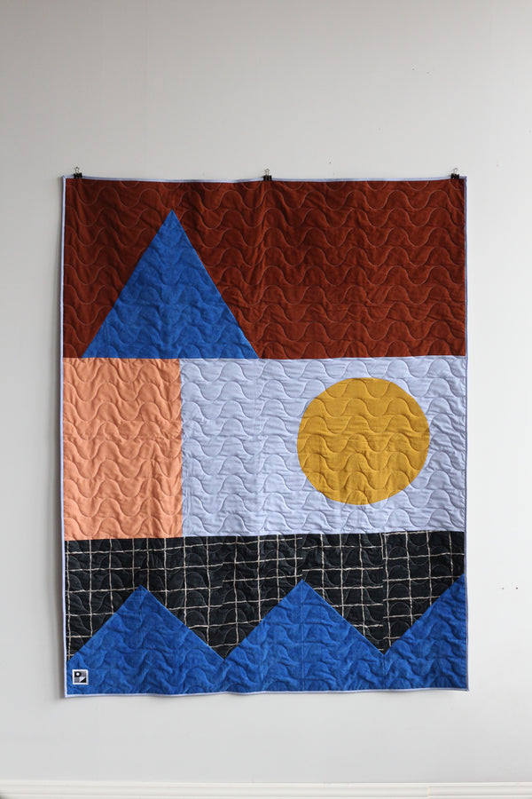 Quilted throw in geometric shapes | 4 colors
