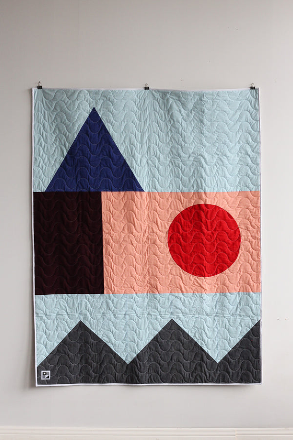 Quilted throw in geometric shapes | 4 colors
